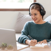 Woman watching video resource on computer.